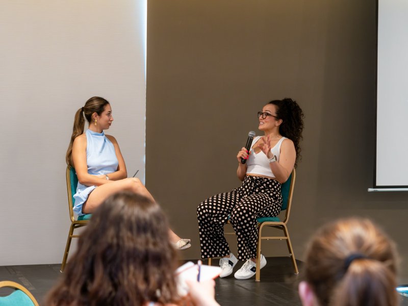 Live conversation on stage at an Ambitious gathering